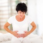 mid age woman having stomach pain